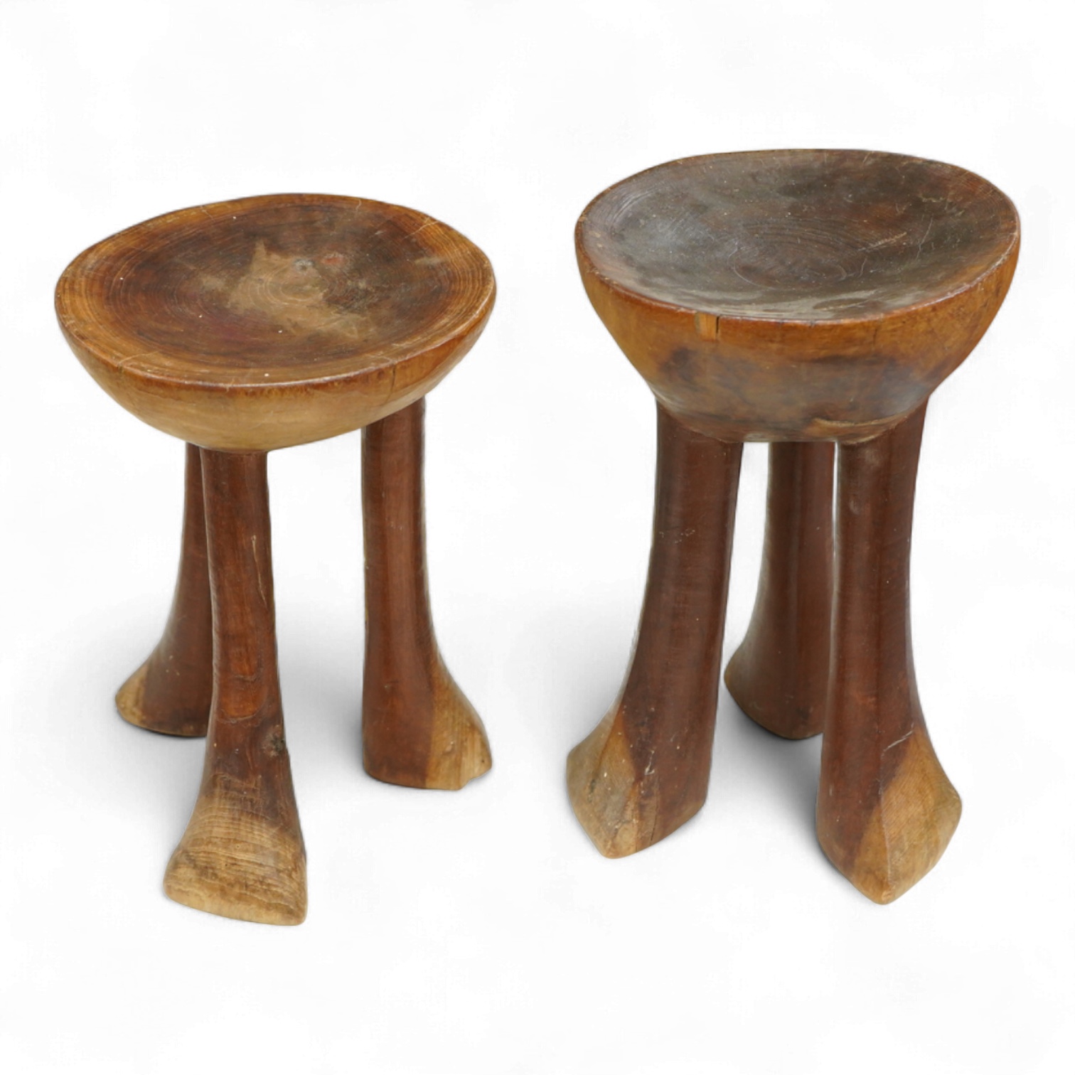 Two African tribal carved hardwood three-legged stools, tallest 28.5cm